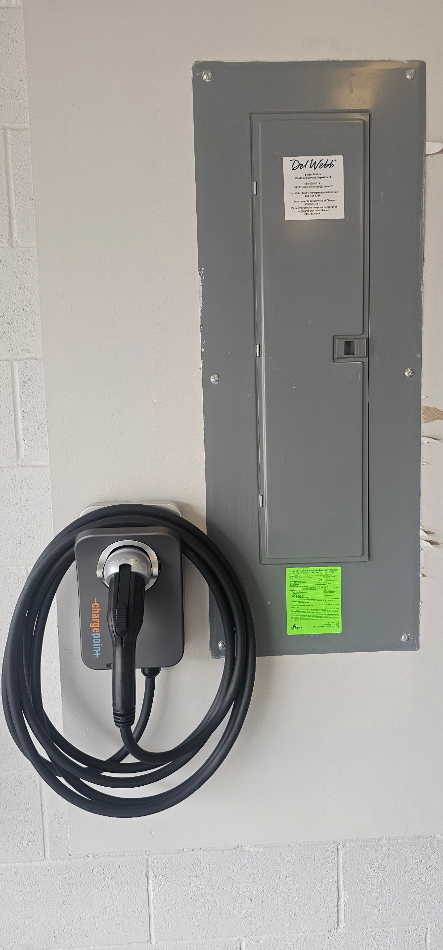 ChargePoint EV charger installed next to a residential panel